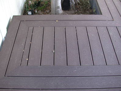 The Sun Coast Deck Way - A deck with boards properly spaced to allow for drainage.
